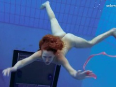 Find-Best-Ass.com presents: Curly hair redhead swims and looks sexy