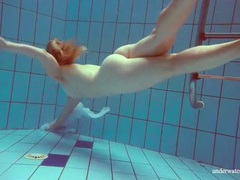 Find-Best-Ass.com presents: Redhead goes for a nude swim in the pool
